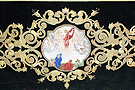 Medallón de la Ascensión en el faldón delantero del paso de palio de Nuestra Madre y Señora de la Soledad