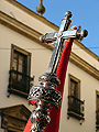 Cruz que remata el asta del Guión Sacramental de la Hermandad de la Sagrada Cena