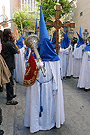 Nazareno con bocina de la Hermandad de Cristo Rey en su Triunfal Entrada en Jerusalén