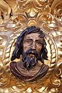 Evangelista en la esquina frontal izquierda de la canastilla del Paso de Misterio del Traslado al Sepulcro de Nuestro Señor Jesucristo