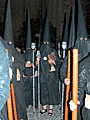 Nazareno portando el Libro de Reglas de la Hermandad del Santo Crucifijo de la Salud