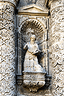 San Jerónimo de Estridón, en la hornacina inferior derecha entre las columnas de orden gigantes (Portada Principal de la Iglesia de San Miguel)