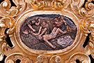 Cartela de la trasera del respiradero del Paso de Nuestro Padre Jesús de la Vía-Crucis - 11º Estación: Jesús clavado en la Cruz